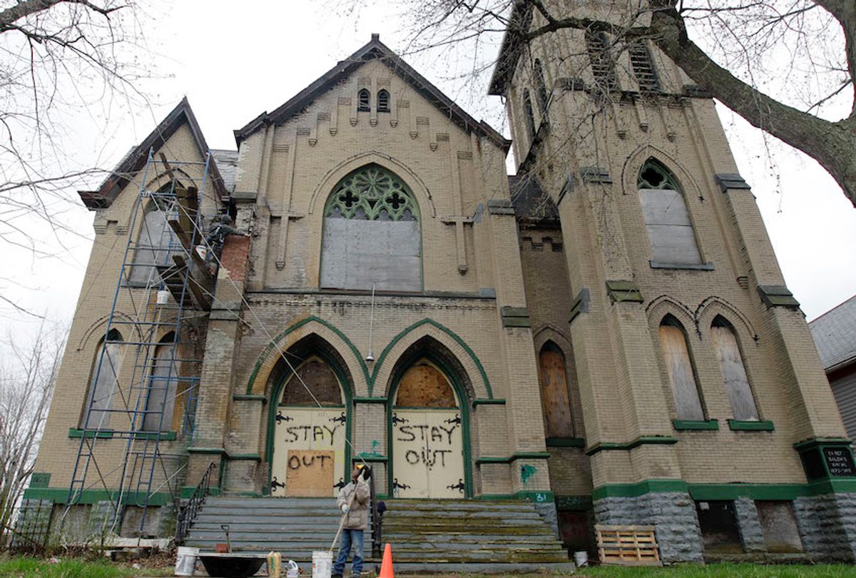 Workers make repairs to the Sunrise Church of Christ in Buffalo, N.Y., Thursday, March 29, 2012. (AP Photo/David Duprey) (AP Photo/David Duprey)