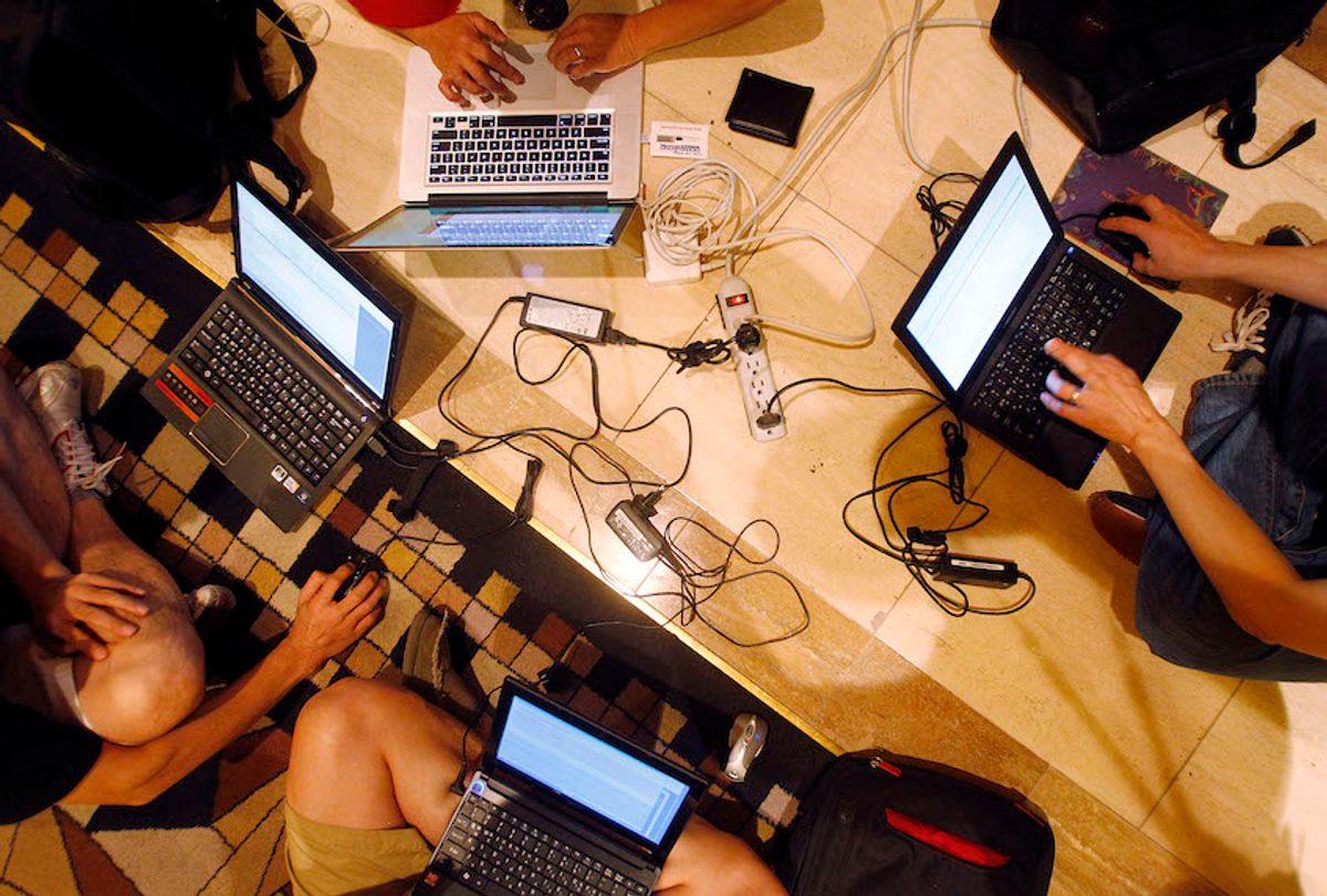 Hackers participate in a competition at the DefCon conference Friday, Aug. 5, 2011, in Las Vegas. (AP Photo/Isaac Brekken)