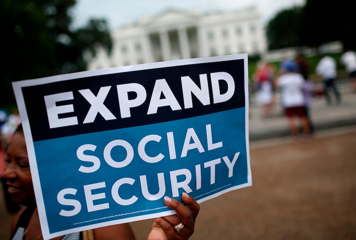 Activists participate in a rally urging the expansion of Social Security benefits in front of the White House July 13, 2015 in Washington, DC. (Win McNamee/Getty Images)
