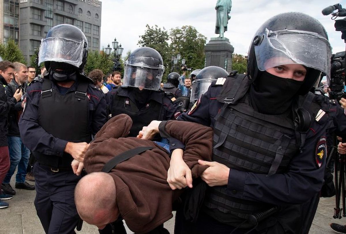 Police officers detain a protestor, during an unsanctioned rally in Pushkin Square in Moscow, Russia, Saturday, Aug. 3, 2019.  (AP/Alexander Zemlianichenko)