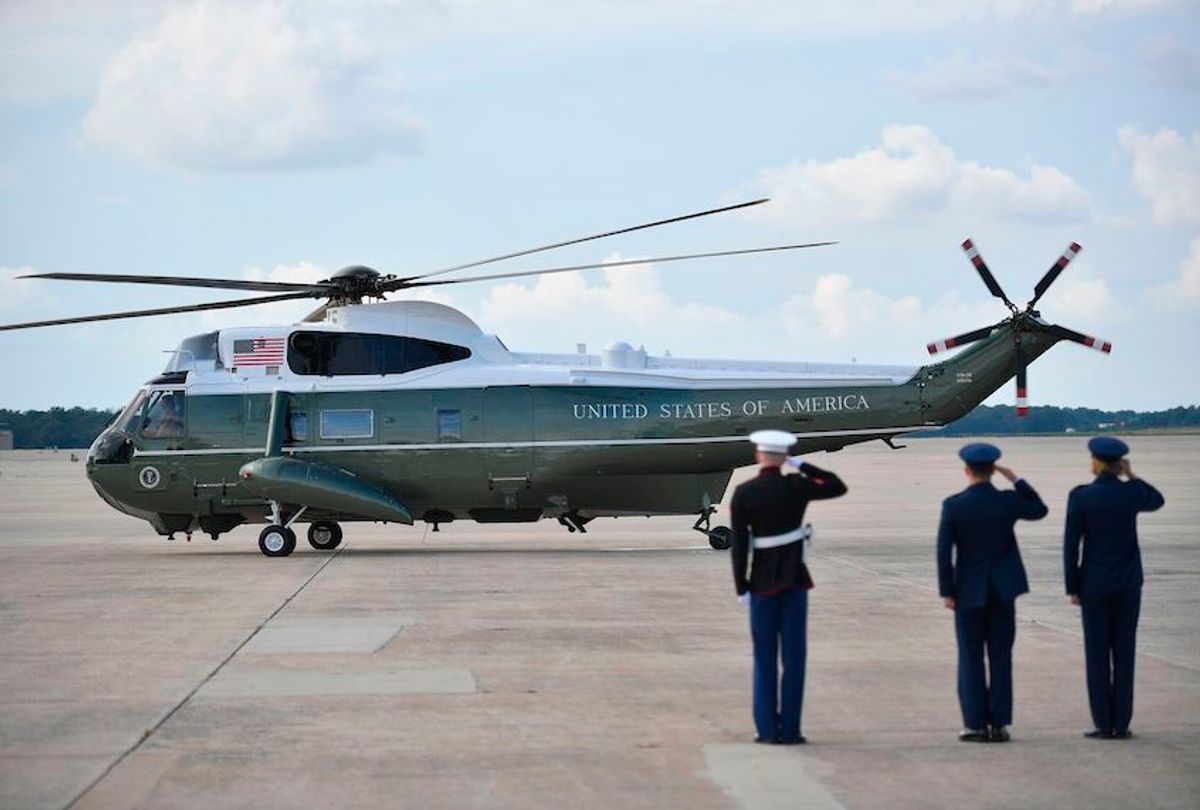 Members of the military salute as US President Donald Trump and First Lady Melania Trump depart on Marine One from Andrews Air Force Base, Maryland on July 7, 2019. - Trump is returning to Washington after spending the weekend at his Bedminster golf resort. (Photo by MANDEL NGAN / AFP)        (Photo credit should read MANDEL NGAN/AFP/Getty Images) (Mandel Ngan/AFP/Getty Images)