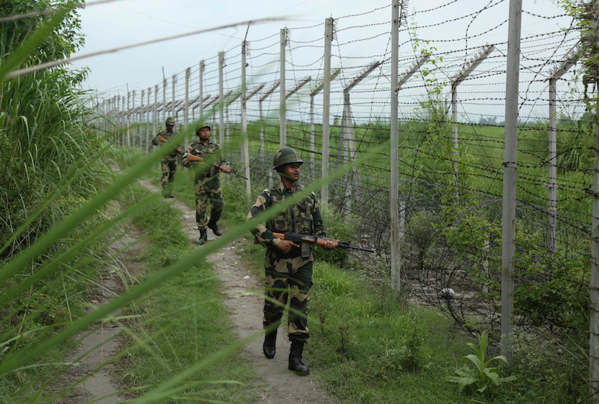 India’s Border Security Force (BSF) soldiers patrol near the India-Pakistan international border fencing at Garkhal in Akhnoor, 35 kilometers (22 miles) west of Jammu, India, Tuesday, Aug.13,2019. (AP Photo/Channi Anand) (AP Photo/Channi Anand)