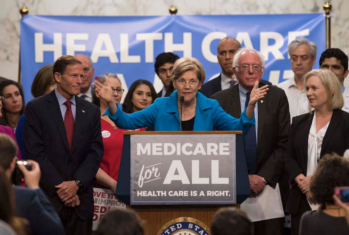 US Senator Elizabeth Warren (C), Democrat from Massachusetts, speaks with US Senator Bernie Sanders (2nd R), Independent from Vermont, as they discusses Medicare for All legislation on Capitol Hill in Washington, DC, on September 13, 2017.  

The former US presidential hopeful introduced a plan for government-sponsored universal health care, a notion long shunned in America that has newly gained traction among rising-star Democrats. / AFP PHOTO / JIM WATSON        (Photo credit should read JIM WATSON/AFP/Getty Images) (Jim Watson/AFP/Getty Images)