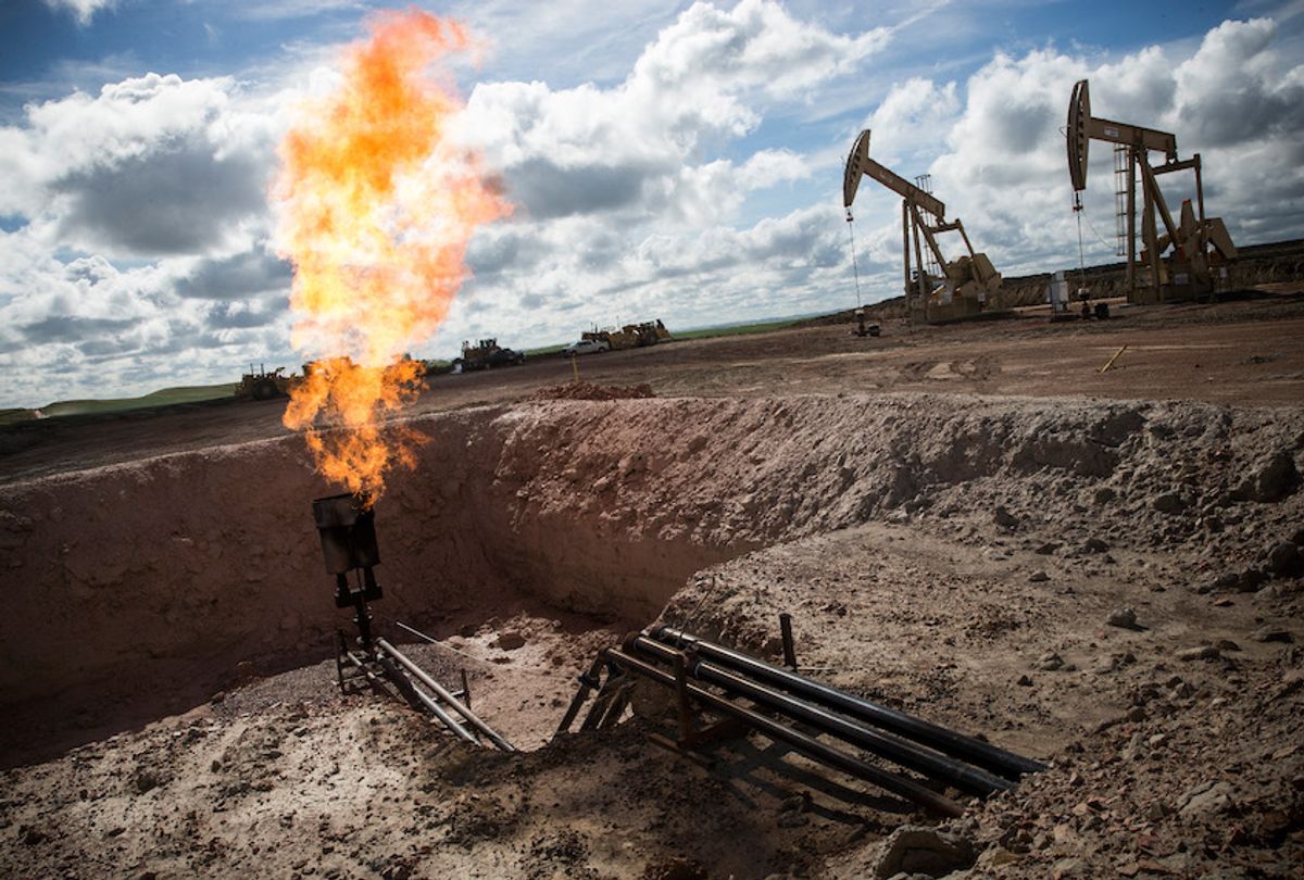 A gas flare at an oil well site on July 26, 2013 in Williston, North Dakota. (Andrew Burton/Getty Images)