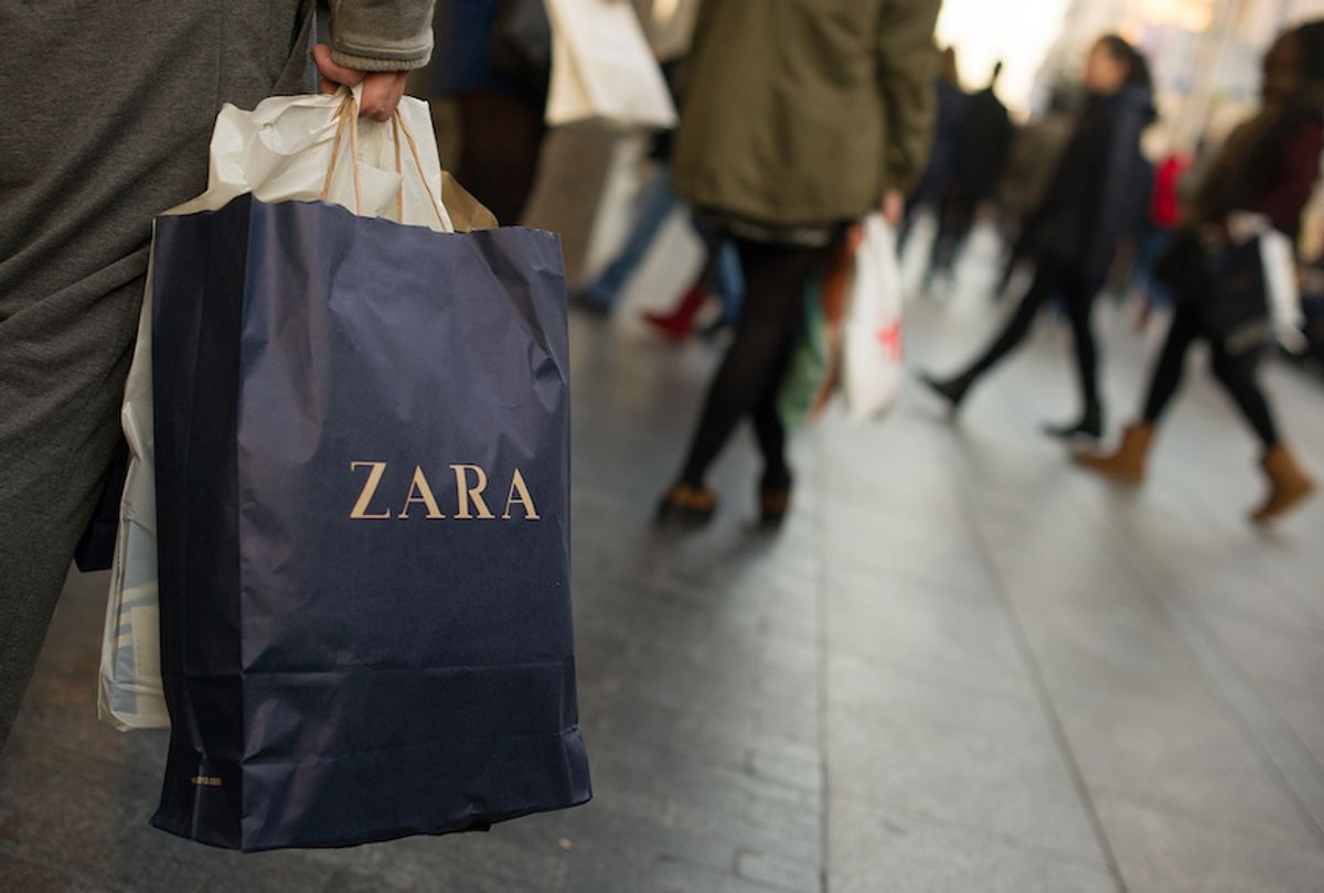 A shopper holds a a branded paper shopping bag from the Zara fashion store on Gran via street on December 19, 2014 in Madrid, Spain.  (Denis Doyle/Getty Images)