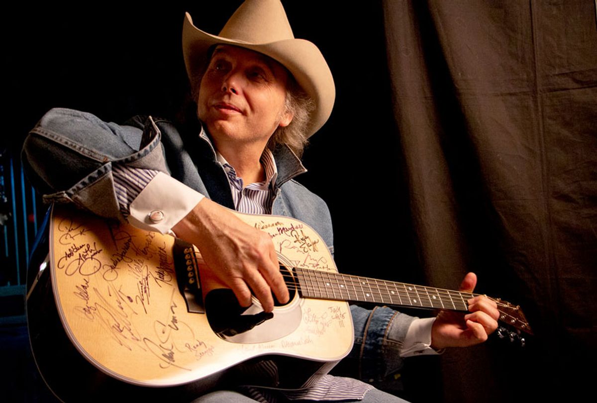Dwight Yoakam signs Martin D-28 guitar. Yoakam is among the 76 of the 101 country music artists interviewed for the series who signed two Martin D-28 guitars. (Jared Ames)