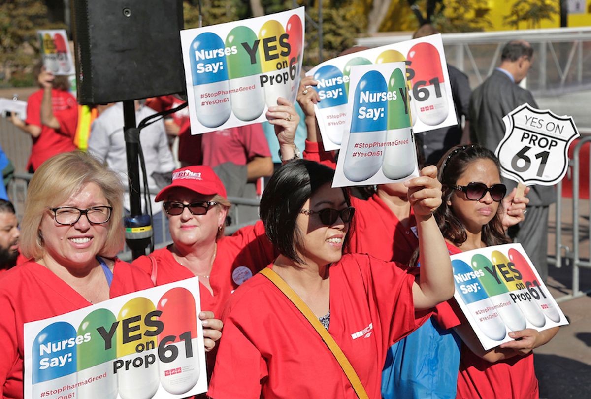 In this Nov. 7, 2016, file photo, nurses express support for a ballot proposition to limit what California state agencies pay for prescription drugs, during a rally with U.S. Sen. Bernie Sanders, I-Vt., in downtown Los Angeles.  (AP Photo/Nick Ut, File)