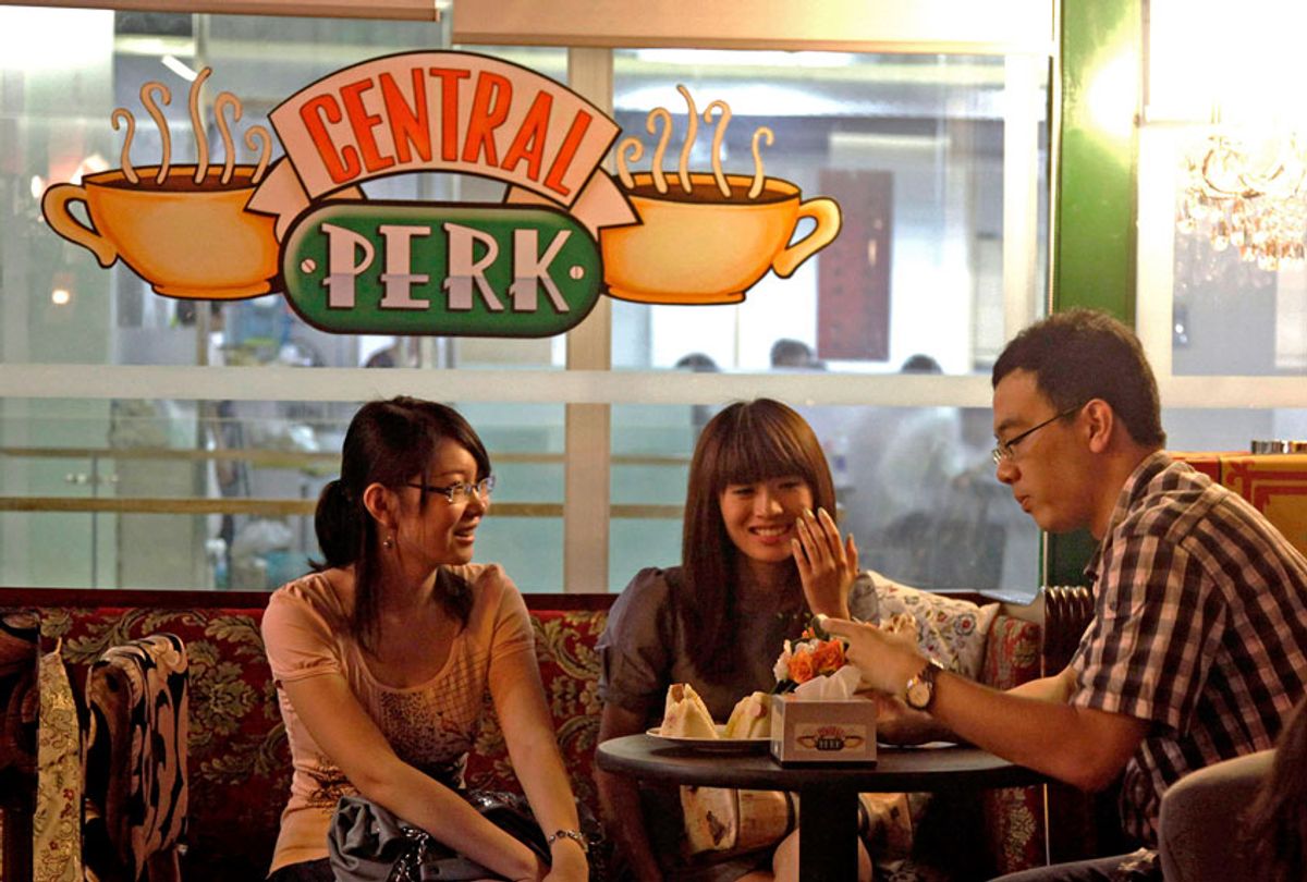 Youths chat at a cafe modeled after the "Central Perk" cafe in the "Friends" sitcom (AP Photo/Ng Han Guan)