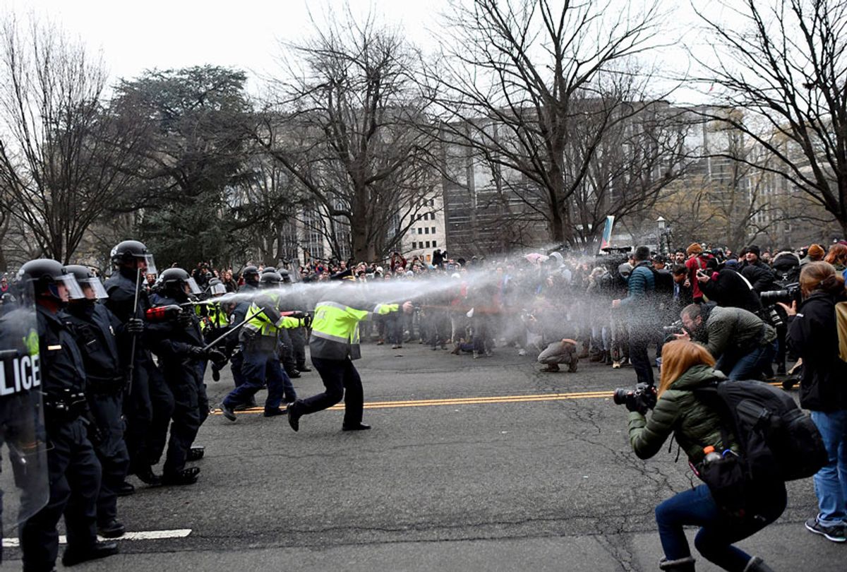 Police pepper spray at anti-Trump protesters during clashes in Washington, DC, on January 20, 2017.  (JEWEL SAMAD/AFP/Getty Images)