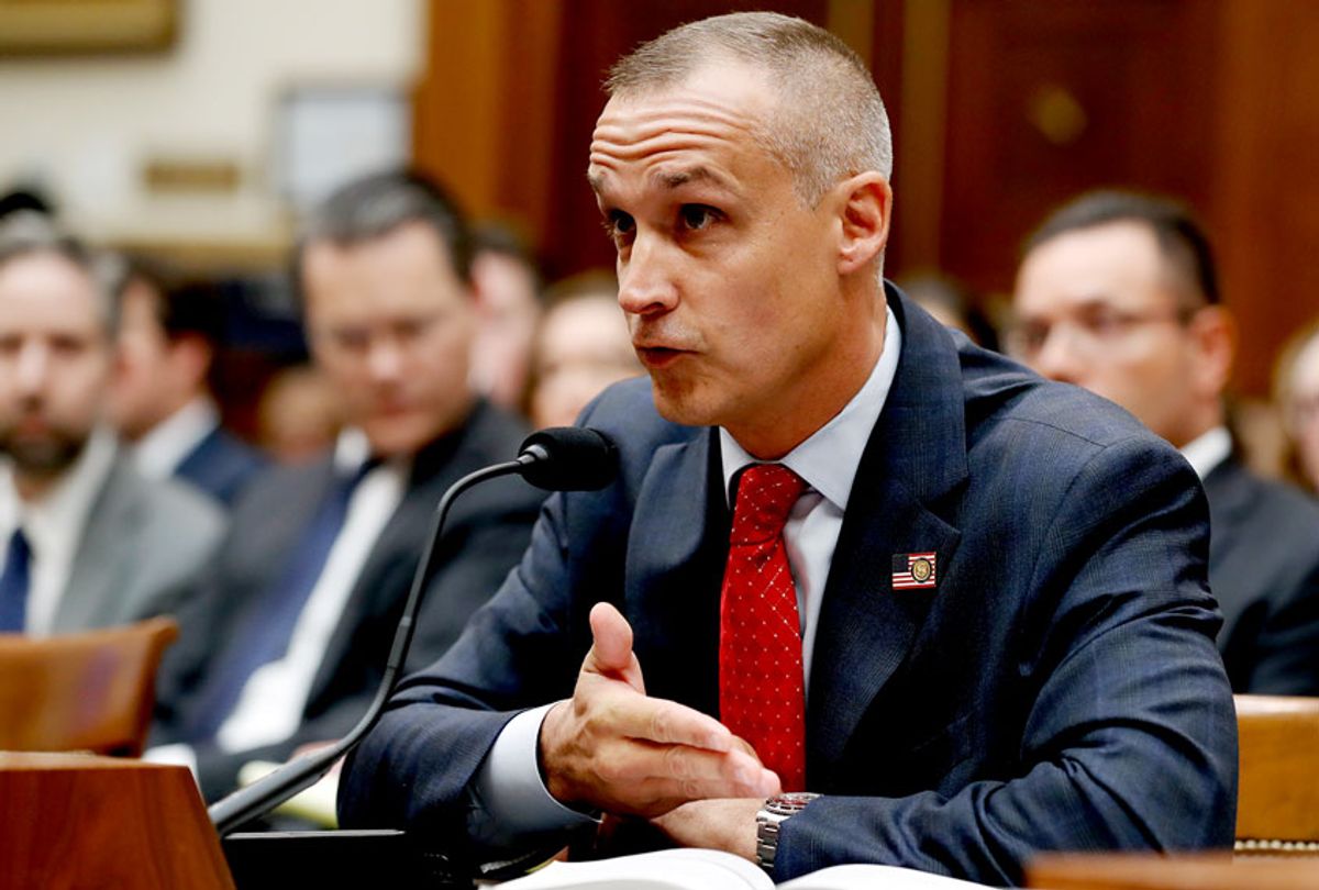 Corey Lewandowski, former campaign manager for President Donald Trump, references a copy of the Mueller Report that he requested to be brought to him, as he testifies to the House Judiciary Committee Tuesday, Sept. 17, 2019, in Washington. (AP Photo/Jacquelyn Martin)