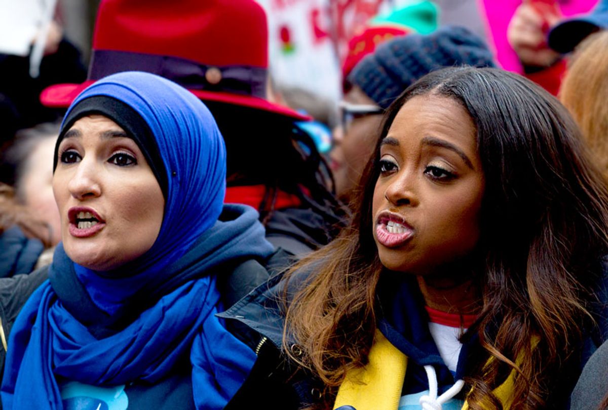 Co-presidents of the 2019 Women's March, Linda Sarsour, left, and Tamika Mallory, center, join other demonstrators on Pennsylvania Avenue during the Women's March in Washington on Saturday, Jan. 19, 2019. (AP Photo/Jose Luis Magana)