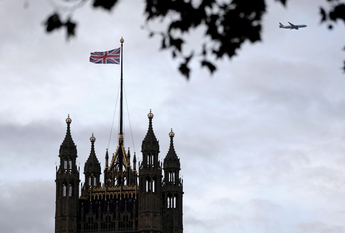 A Union flag flies from a pole atop the Victoria Tower at the Houses of Parliament in London on October 9, 2019. (Isabel Infantes/AFP via Getty Images)