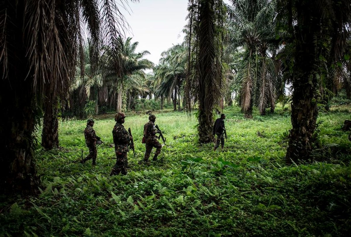TOPSHOT - A picture taken on November 13, 2018, shows Tanzanian soldiers from the United Nations Organization Stabilization Mission in the Democratic Republic of the Congo (MONUSCO) patroling against Ugandan Allied Democratic Force (ADF) rebels in Beni. - The Beni area has for the last four years been under seige from the ADF, an Islamist armed group that has killed hundreds of people since 2014. (Photo by John WESSELS / AFP)        (Photo credit should read JOHN WESSELS/AFP/Getty Images) (John Wessels/AFP/Getty Images)