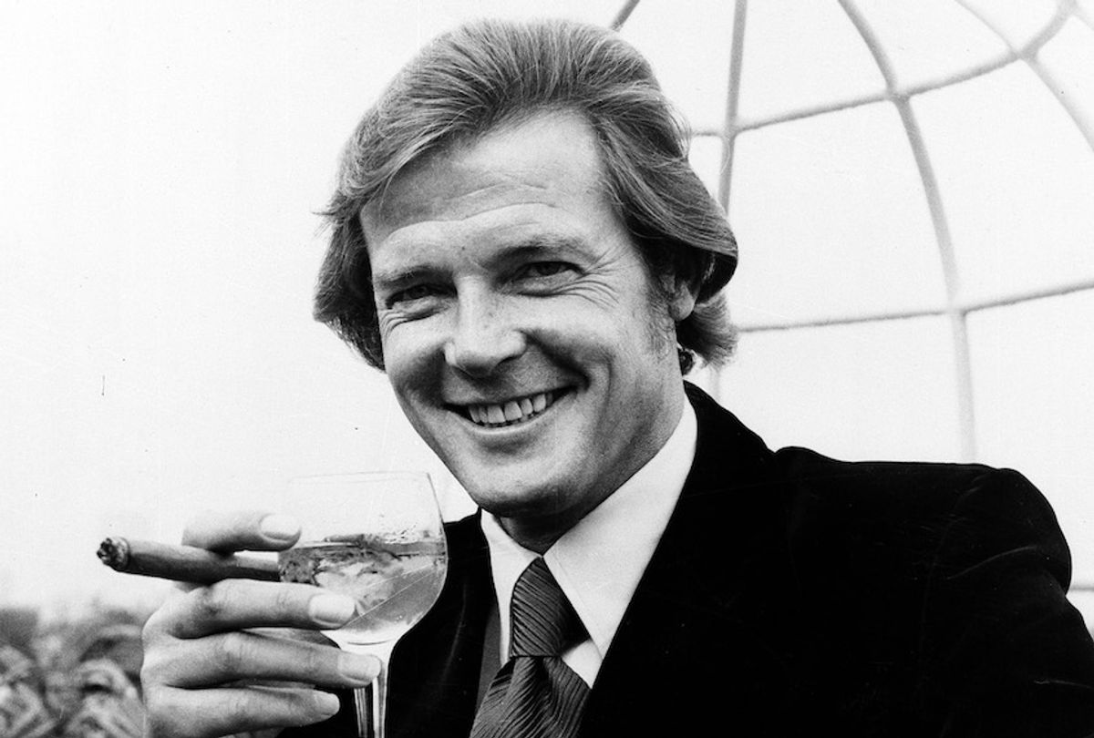 Actor Roger Moore poses with a martini and a big cigar at the Dorchester Hotel in London, on August 1, 1972. (AP Photo)