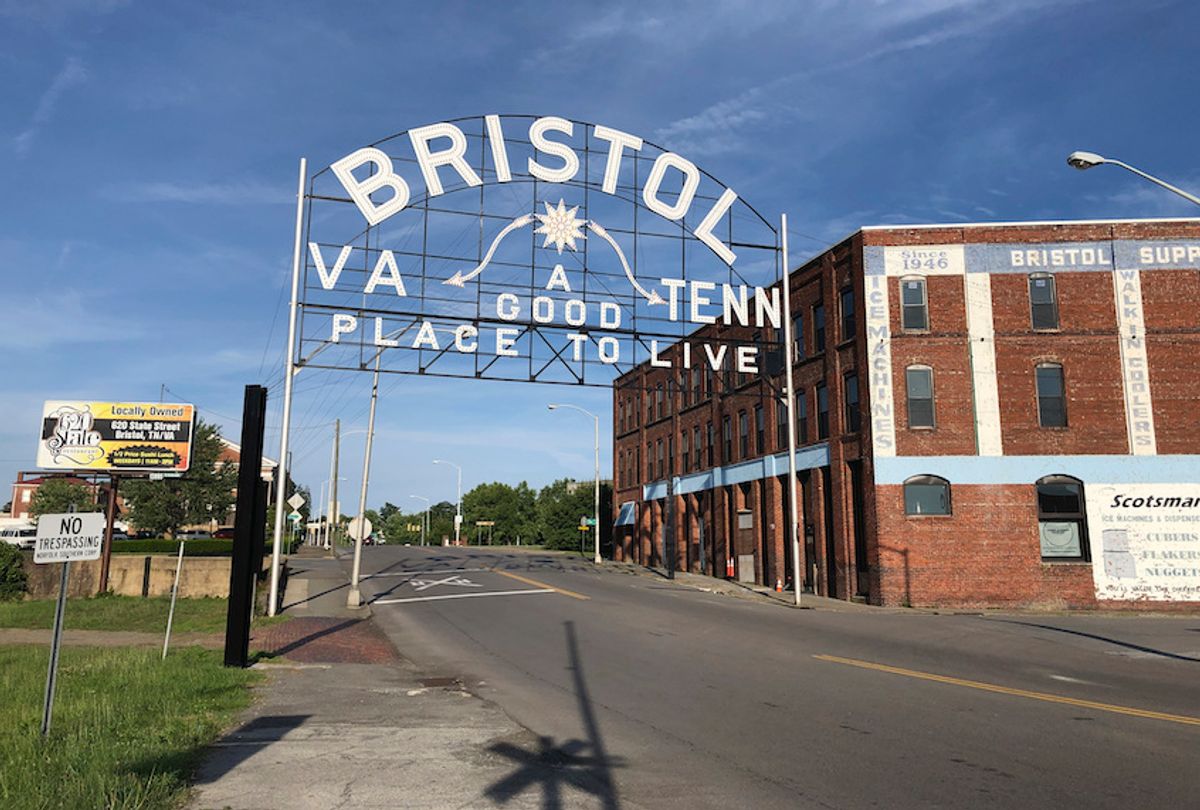 In this June 26, 2019 photo, A sign leading out of downtown Bristol, Va., a city that straddles two states, Tenn. and Va., is seen.  (AP Photo/Sudhin Thanawala)