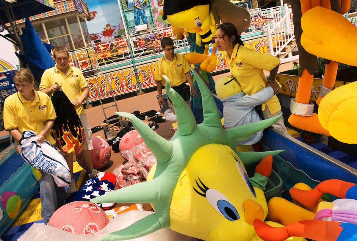 Russian students working at a Jolly Roger amusement park prepare stuffed animals for prizes in Ocean City, Maryland.  (Mandel Ngan/AFP/Getty Images)