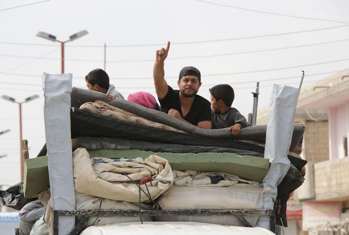 Displaced Syrians arrive in the border town of Tal Abyad on October 17, 2019, as Turkey and its allies continue their assault on Kurdish-held border towns in northeastern Syria. (Bakr Alkasem/AFP via Getty Images)