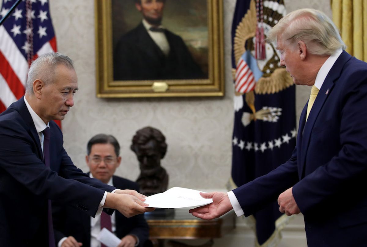 Chinese Vice Premier Liu He presents U.S. President Donald Trump with a letter from Chinese President Xi Jinping after Trump announced a "phase one" trade agreement with China in the Oval Office at the White House October 11, 2019 in Washington, DC.  China and the United States have slapped each other with hundreds of billions of dollars in tariffs since the current trade war began between the world‚Äôs two largest national economies in 2018. (Photo by Win McNamee/Getty Images) (Win McNamee/Getty Images)