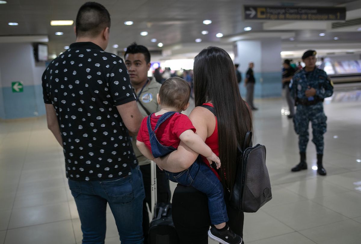 A Guatemalan Homeland Security Investigations (HSI) agent speaks with travelers at the airport on August 26, 2019 in Guatemala City, Guatemala.  (John Moore/Getty Images)