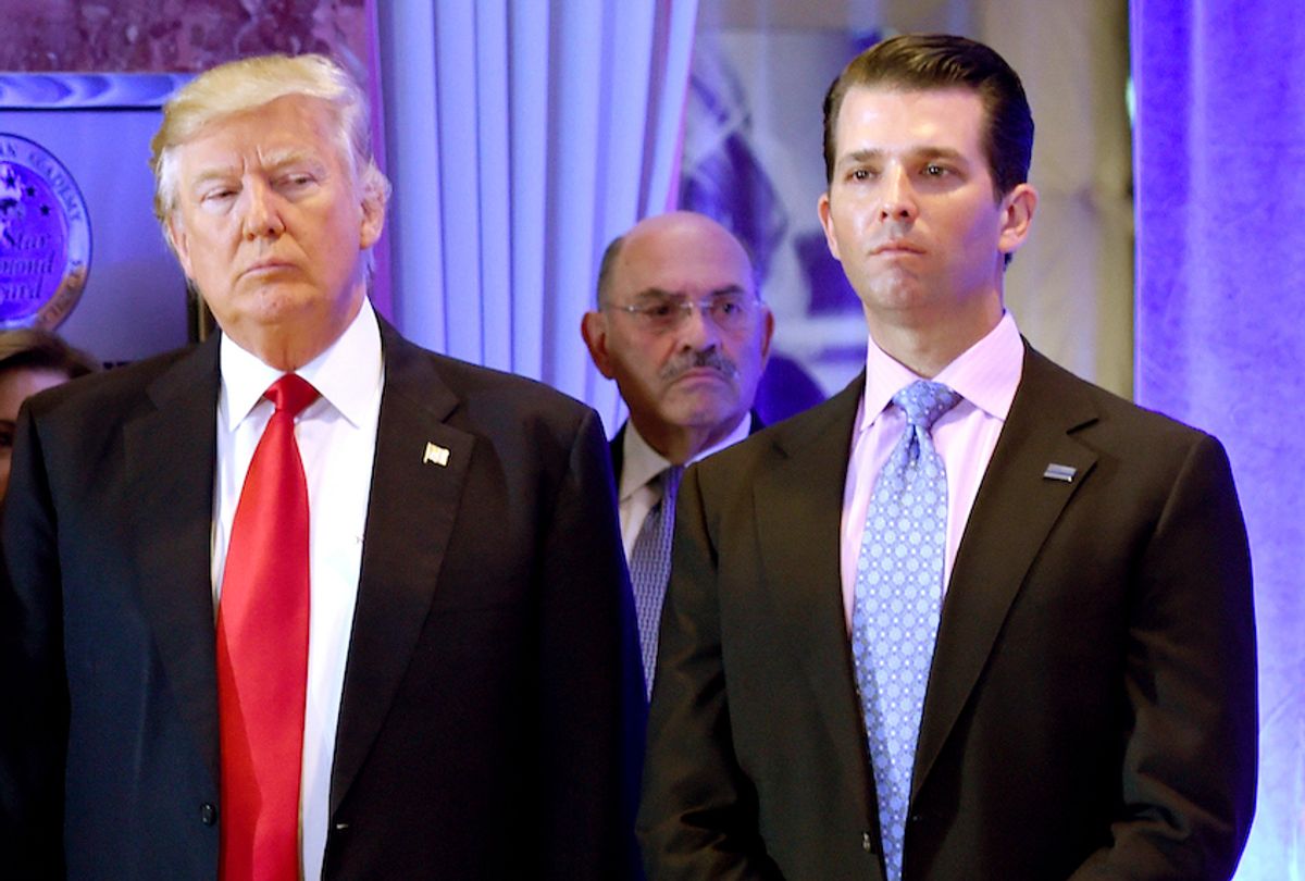 Donald Trump along with his son Donald, Jr., arrive for a press conference at Trump Tower in New York, as Allen Weisselberg (C), chief financial officer of The Trump, looks on January 11, 2017. (Timothy A. Clary/AFP via Getty Images)