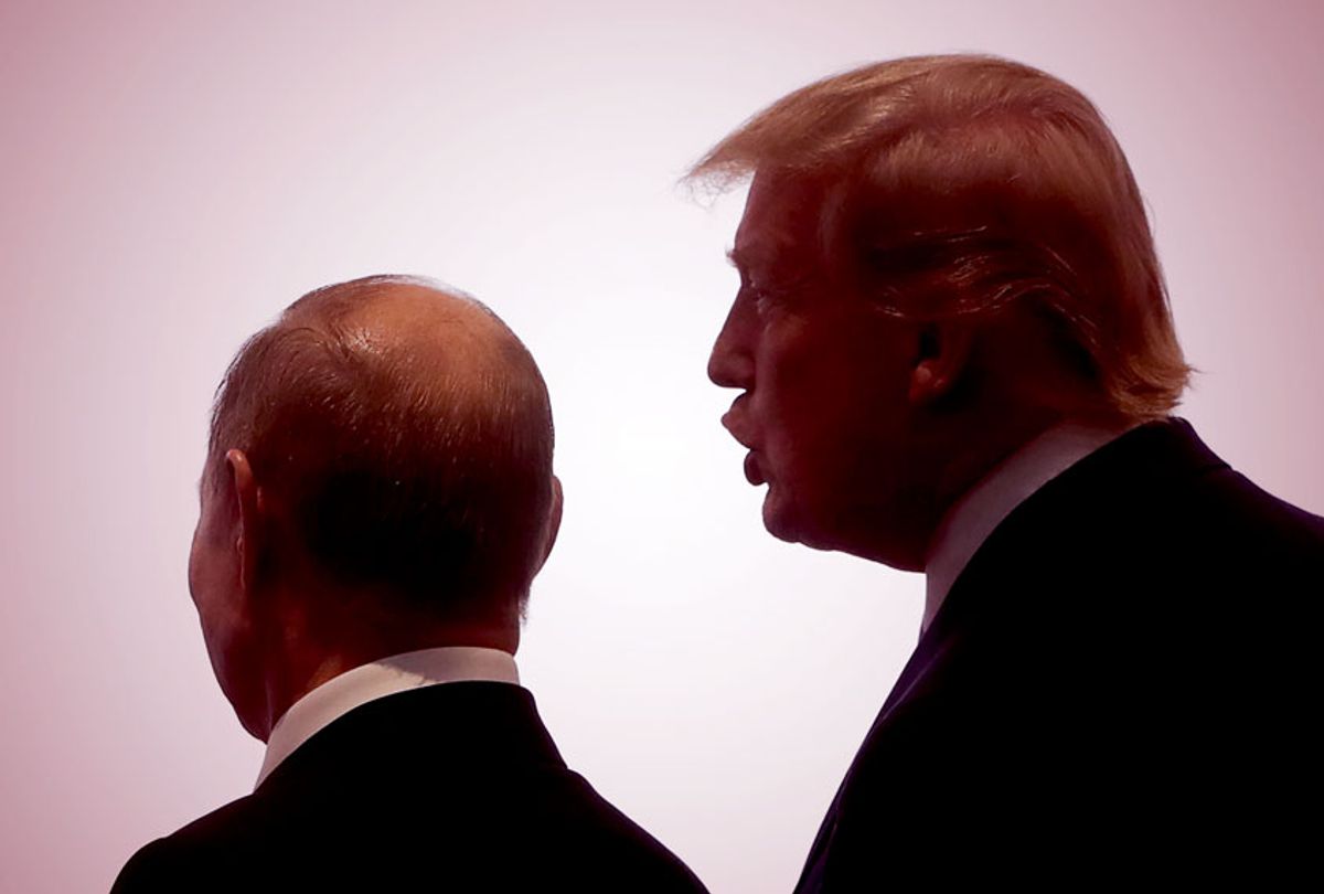 Russia's President Vladimir Putin (L) and US President Donald Trump pose at an official meeting ceremony for the heads of delegations from the G20 member countries, invited guests and international organisations participating in the 2019 G20 Summit at the INTEX Osaka International Exhibition Centre. (Mikhail Metzel\TASS via Getty Images)