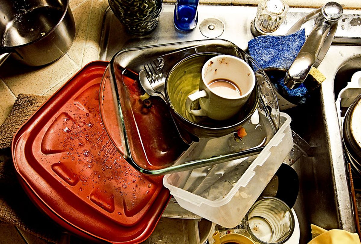 Dirty dishes stacked in kitchen sink. (Getty Images/Mardis Coers)