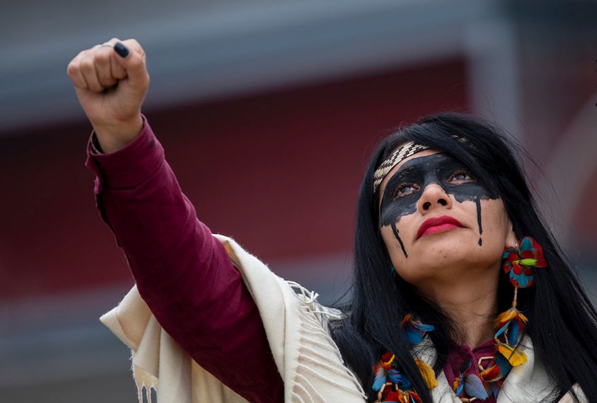 An indigenous leader from Brazil takes part in a protest outside REPSOL Headquarters on December 08, 2019 in Madrid, Spain. Indigenous leaders and activists are protesting in Madrid against oil contamination and the fossil fuel industry in Brazil because of the damage it provokes to the poorest communities, sea life, food supplies and the climate.  (Pablo Blazquez Dominguez/Getty Images)
