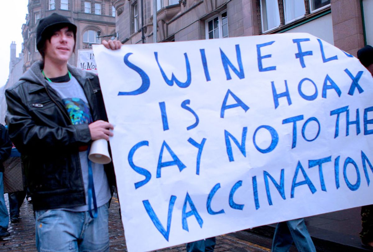 Protesters march to the Scottish Parliament in an "anti-swine flu vaccination protest" along the Royal Mile Edinburgh.  (David Cheskin/PA Images via Getty Images)