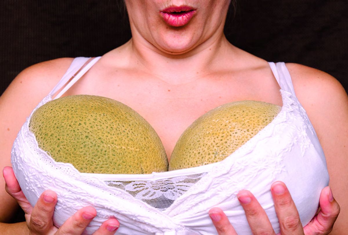 A woman holds melons in her shirt. (Getty Images)