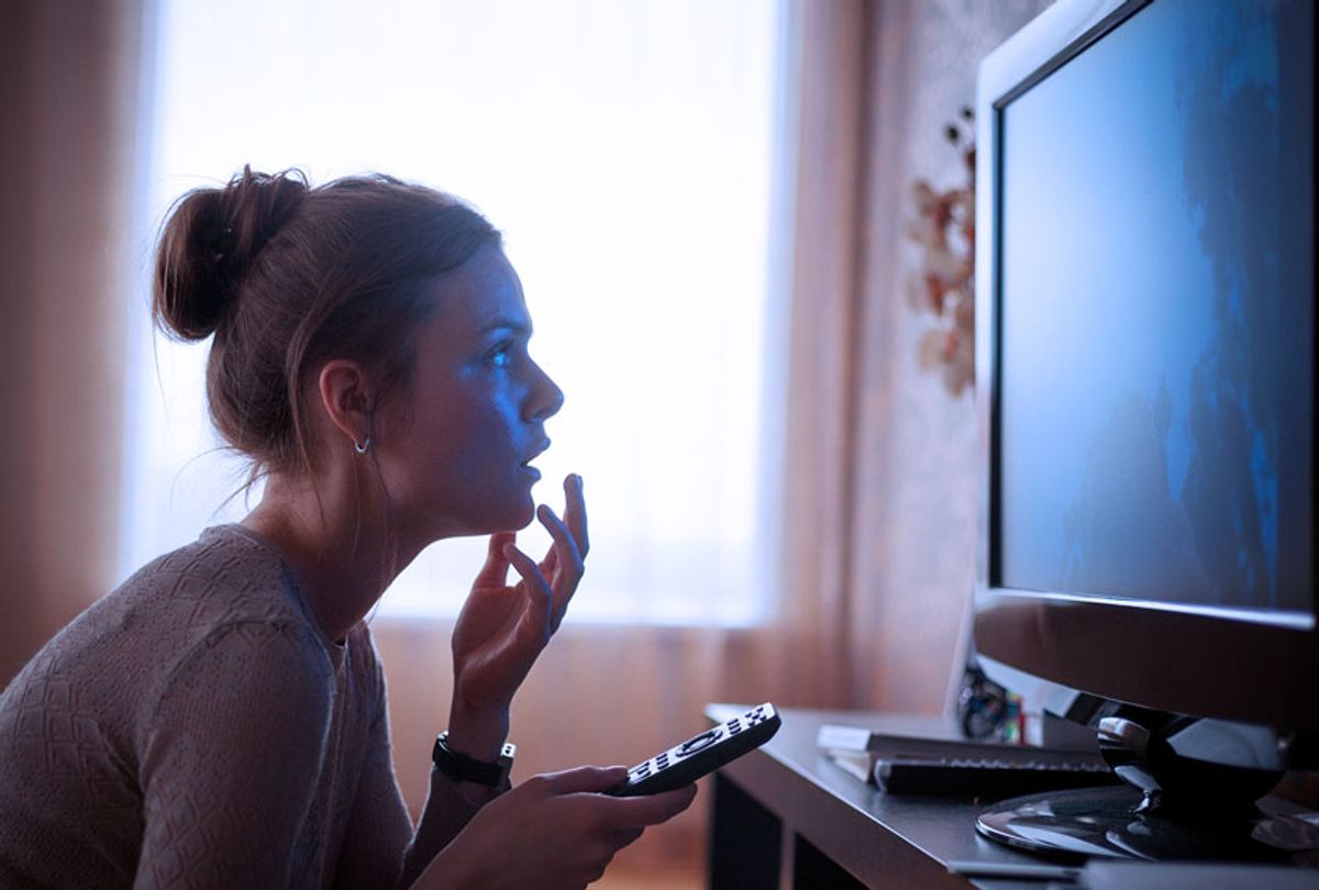 Woman up close to the TV (Getty Images)