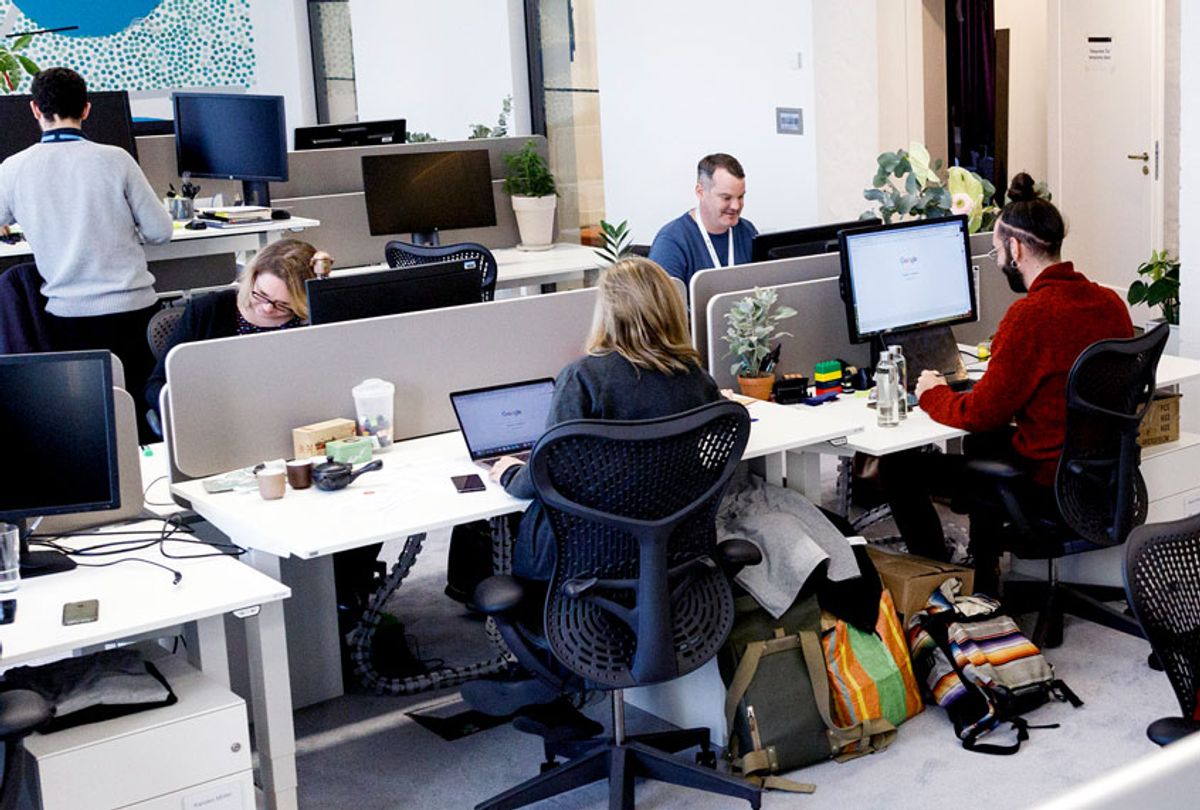 Google employees work in their office (Carsten Koall/Getty Images)