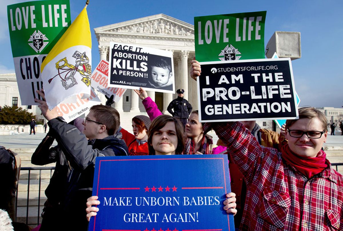 In this Friday, Jan. 18, 2019 file photo, anti-abortion activists protest outside of the U.S. Supreme Court, during the March for Life in Washington. President Trump's call for a ban on late-term abortions is unlikely to prevail in Congress, but Republican legislators in several states are pushing ahead with tough anti-abortion bills of their own that they hope can pass muster with the reconfigured U.S. Supreme Court. (AP Photo/Jose Luis Magana)