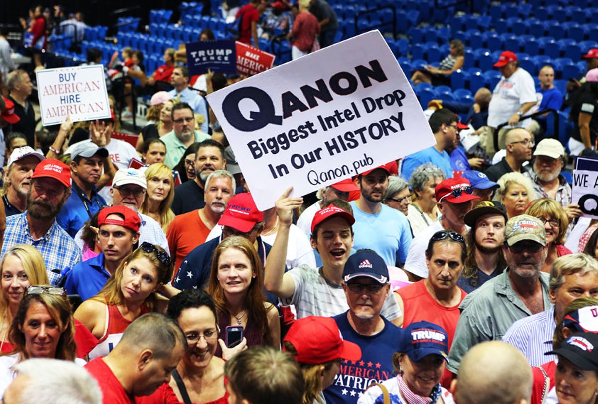 Trump supporters displaying QAnon posters appeared at President Donald J. Trumps Make America Great Again rally (Thomas O'Neill/NurPhoto via Getty Images)