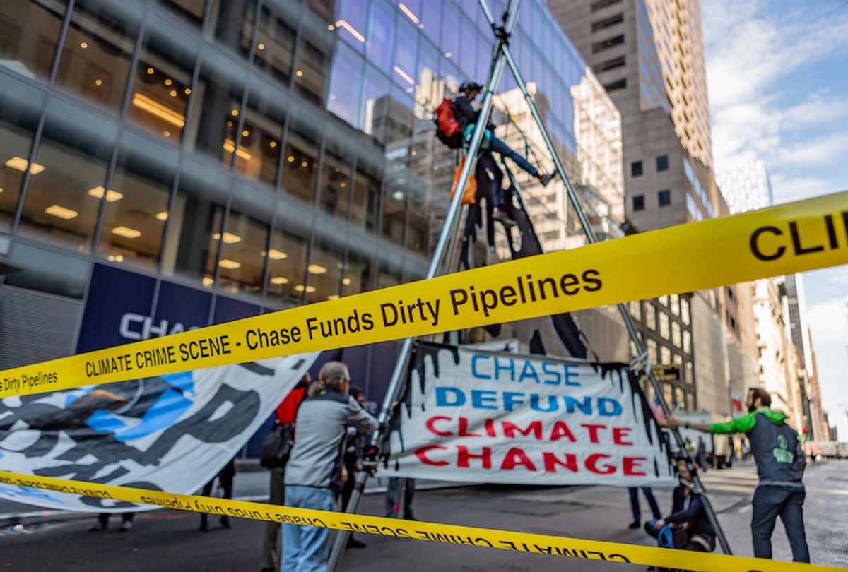 Climate activists protest Chase Bank's continued funding of the fossil fuel industry by setting up a tripod-blockade in midtown Manhattan. (Michael Nigro/Pacific Press/LightRocket via Getty Images)