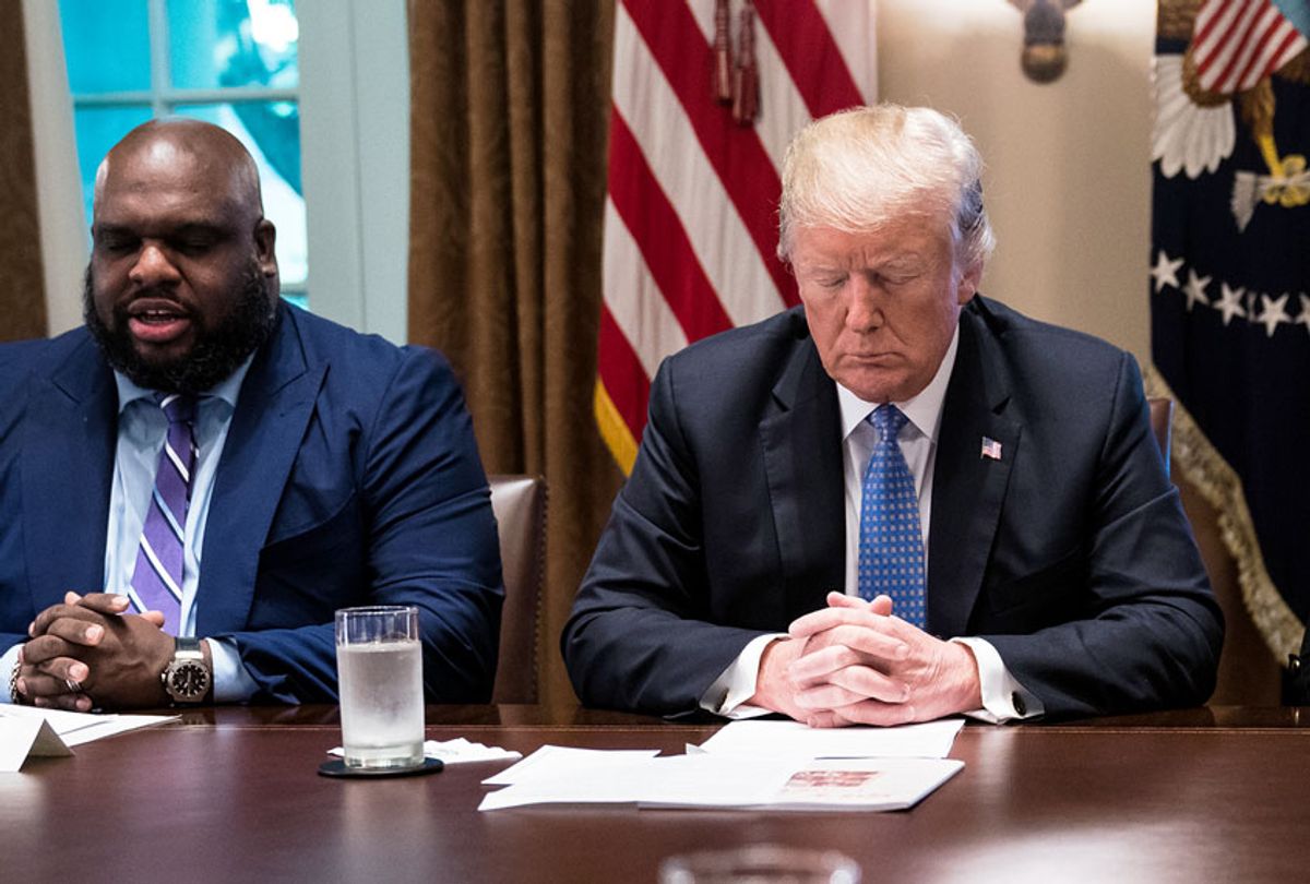 President Donald J. Trump bows his head during a prayer at a meeting with inner city pastors in the Cabinet Room of the White House on Wednesday, Aug 01, 2018 in Washington, DC.  (Donald Trump)