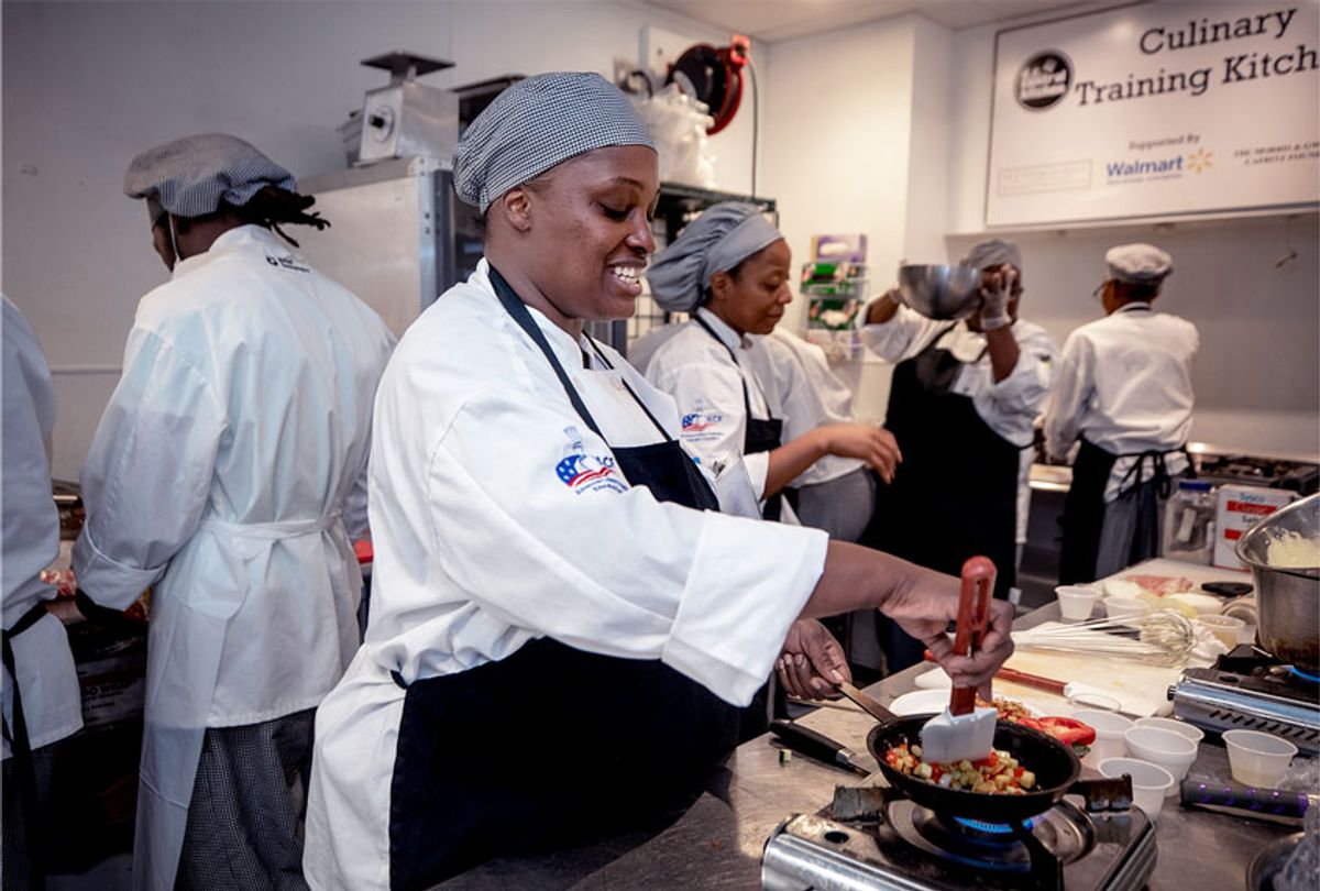 Saroyal Booker, practices sautéing vegetables before her final exam at the Culinary Job Training program at DC Central Kitchen in Washington, DC. Saroyal is staying at Friends of Guest House in Alexandria, Virginia, which helps women successfully reenter the workforce from incarceration. (Evelyn Hockstein/For The Washington Post via Getty Images)