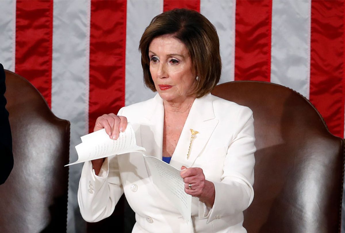 House Speaker Nancy Pelosi of Calif., tears her copy of President Donald Trump's State of the Union address after he delivered it to a joint session of Congress on Capitol Hill in Washington, Tuesday, Feb. 4, 2020.  (AP Photo/Alex Brandon)