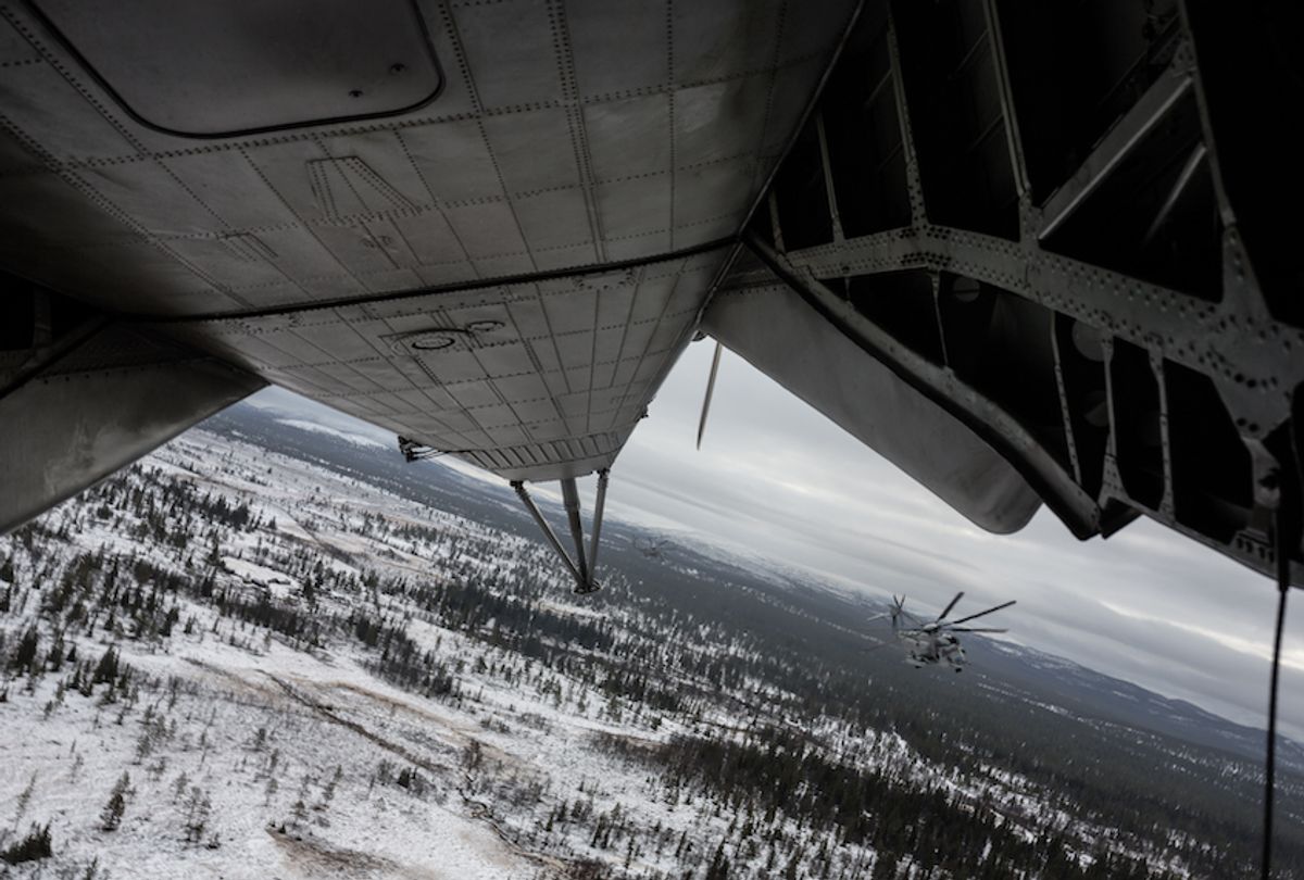 A U.S. Marine Corps CH-53E Super Stallion helicopter on the lookout during an air mobile operation during cold-weather training in support of Exercise Trident Juncture 18 on November 1, 2018 in Dalsbygda, Norway. (Till Rimmele/Getty Images)