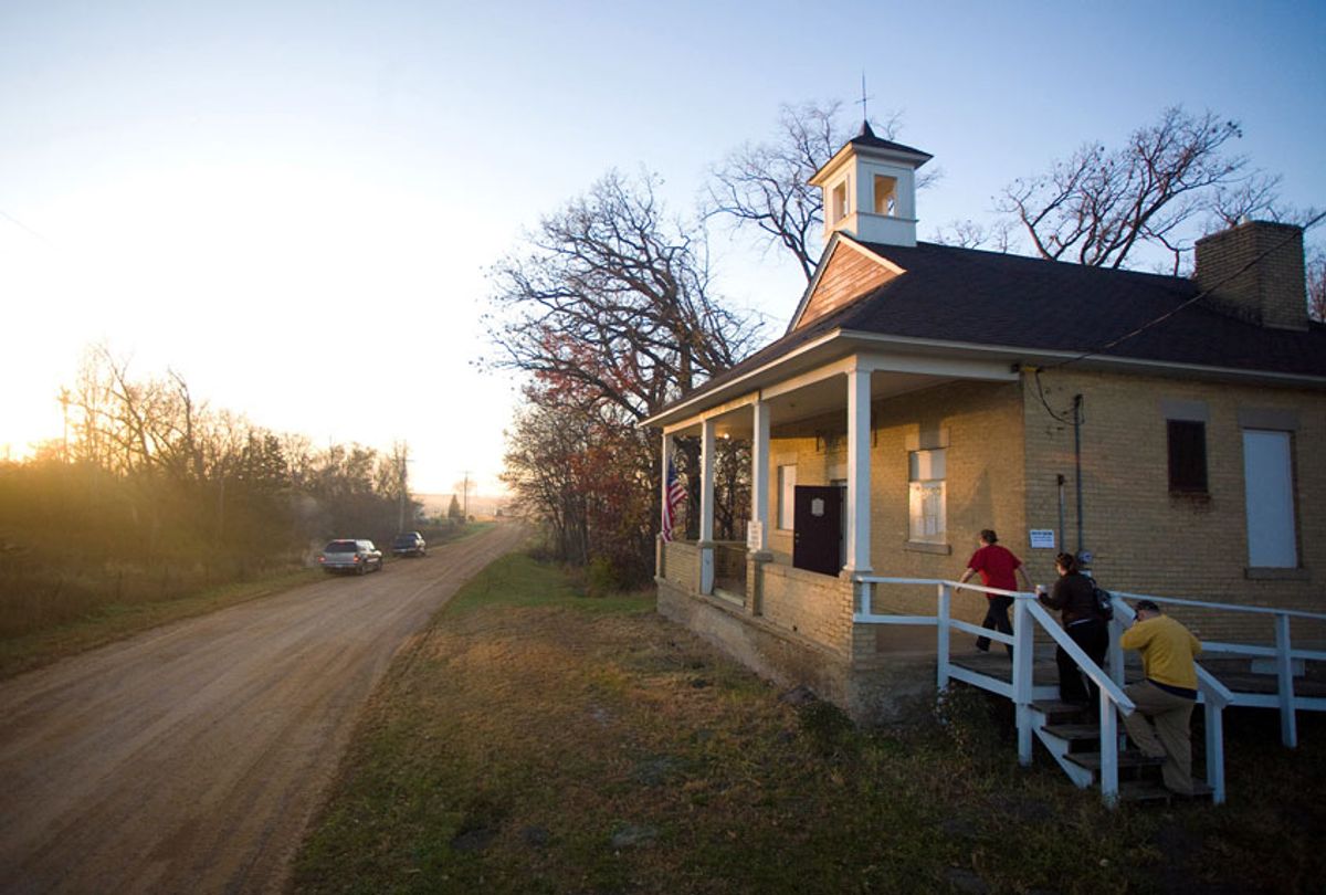 People enter the town hall just after sunrise to cast their ballot in the US presidential election on November 4, 2008 in the rural township of San Francisco, Minnesota. The town hall, which is a converted one room school house, serves as the polling location for the township.  (Cory Ryan/Getty Images)