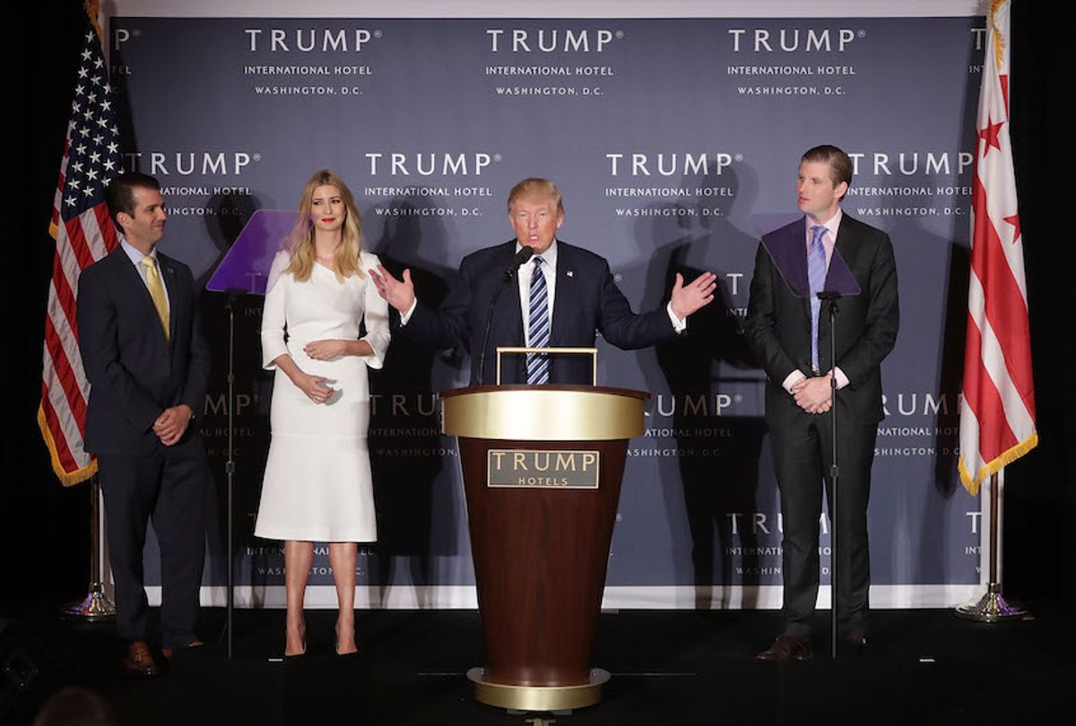 Donald Trump (C) delivers remarks with his children (L-R) Donald Trump Jr., Ivanka Trump and Eric Trump during the grand opening ceremony of the new Trump International Hotel October 26, 2016 in Washington, DC.  (Chip Somodevilla/Getty Images)