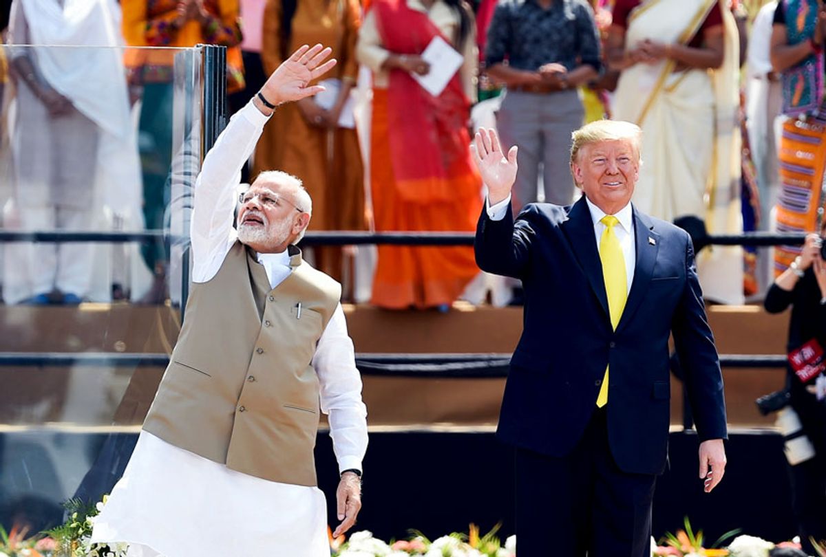 US President Donald Trump (R) and India's Prime Minister Narendra Modi wave at the crowd during 'Namaste Trump' rally at Sardar Patel Stadium in Motera, on the outskirts of Ahmedabad, on February 24, 2020.  (MONEY SHARMA/AFP via Getty Images)