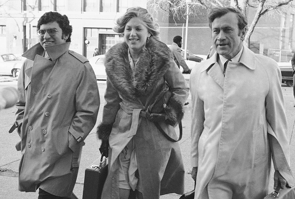 Three of the assistant Washington prosecutors in the Watergate cover-up trial arrive at U.S. District Court in Washington on Friday, Nov. 8, 1974. From left are: Richard Ben-Veniste, Jill Volner, and James Neal. (Charles Bennett/AP)