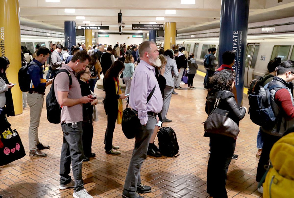 Afternoon commuters wait for their trains at Montgomery BART station in San Francisco, Calif., on Wednesday, March 4, 2020. Some commuters opted to wear respiratory masks as one person became the first victim in California to die from the coronavirus disease. Also, the first two cases in San Francisco were reported the following day. (Ray Chavez/MediaNews Group/The Mercury News via Getty Images)