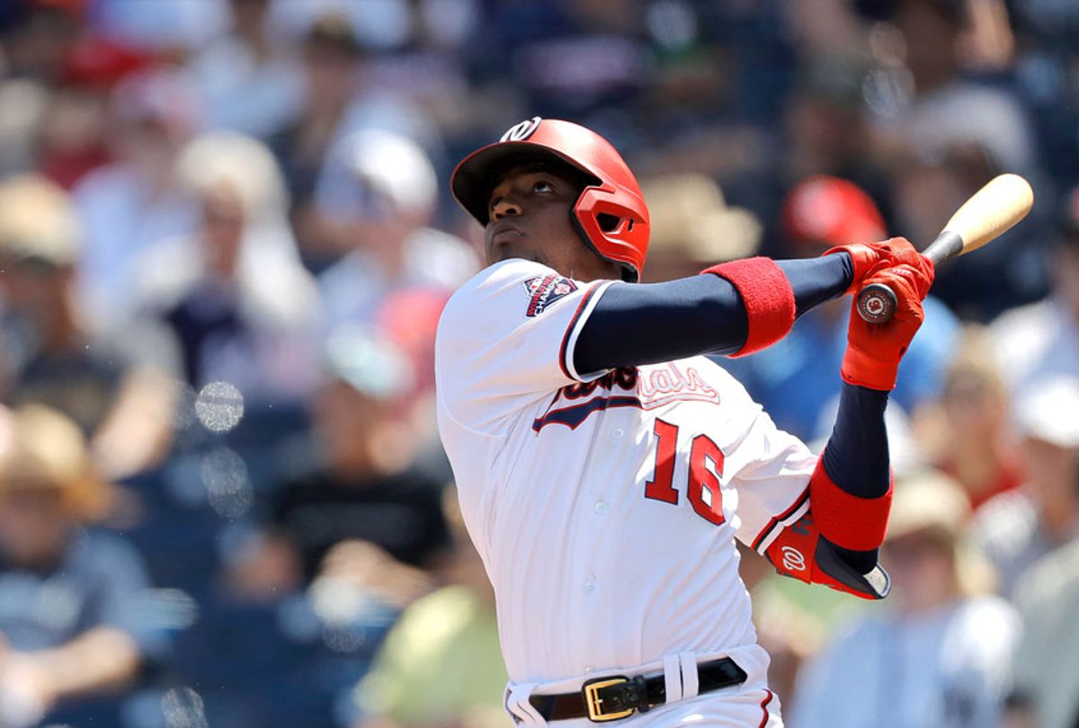 Washington Nationals' Victor Robles watches his ball as he hits a solo home run off New York Yankees pitcher Jonathan Loaisiga during the third inning of a spring training baseball game, Thursday, March 12, 2020, in West Palm Beach, Fla.  (AP Photo/Julio Cortez)
