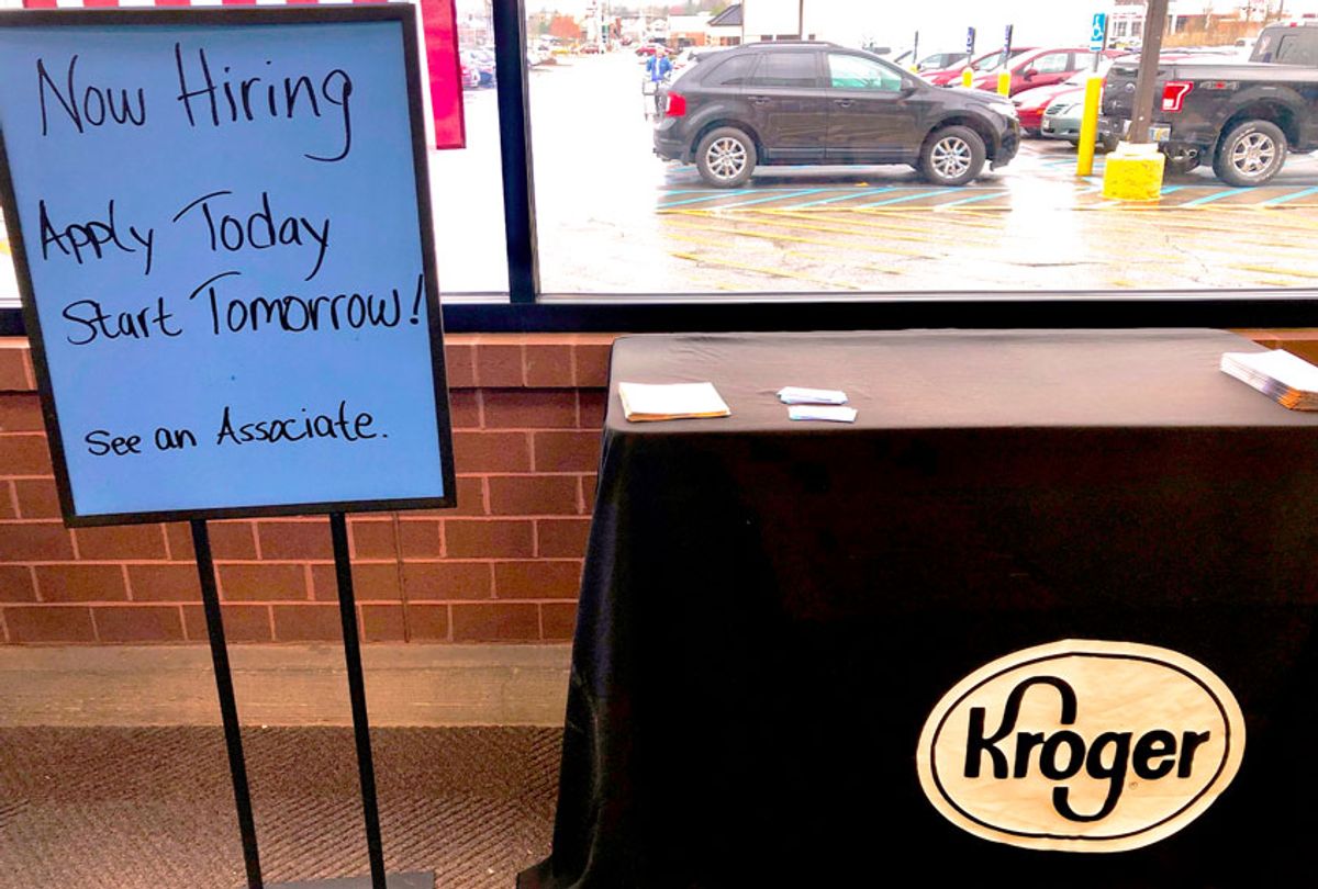 A sign encouraging job seekers to apply stands in a suburban Cincinnati Kroger store. (AP Photo/Dan Sewell)