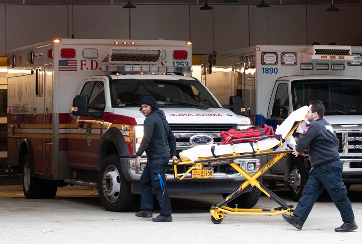 Emergency Medical Technicians wheel a collapsible wheeled stretcher into the emergency room at NewYork-Presbyterian Lower Manhattan Hospital, Wednesday, March 18, 2020, in New York.  (AP Photo/Mary Altaffer)