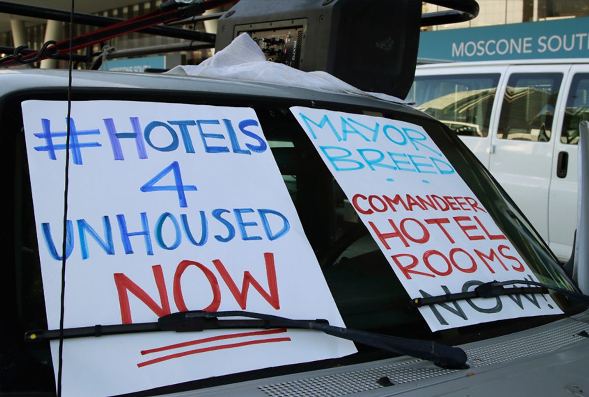 In this April 3, 2020, file photo, activists protest from vehicles outside Moscone Center, asking San Francisco Mayor London Breed to house homeless people using vacant hotels in San Francisco. San Francisco's mayor reported Friday, April 10, 2020, that 70 people at the city's largest homeless shelter have tested positive for COVID-19, infuriating advocates of the homeless who have been pushing the city for weeks to get people out of crowded shelters and into individual hotel rooms. 
 (AP Photo/Ben Margot, File)