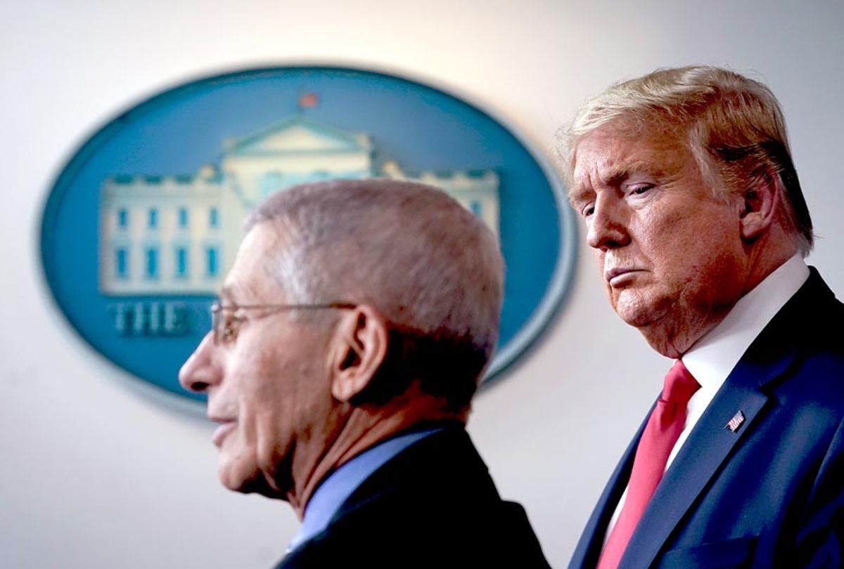 Dr. Anthony Fauci, director of the National Institute of Allergy and Infectious Diseases, speaks as U.S. President Donald Trump looks on during a briefing on the coronavirus pandemic (Drew Angerer/Getty Images)