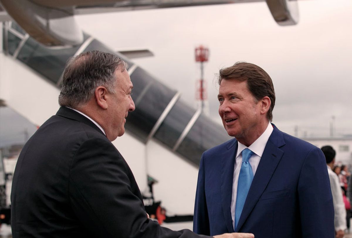 Secretary of State Mike Pompeo, left, talks with U.S. Ambassador to Japan Bill Hagerty as Pompeo arrives in Osaka, Japan (AP Photo/Jacquelyn Martin)