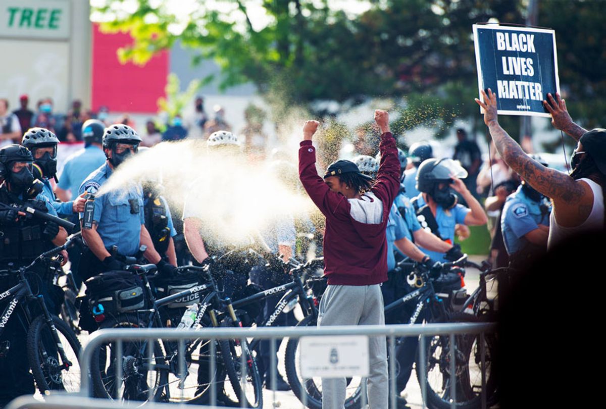 Minneapolis police pepper spray a protestor on Wednesday, May 27, 2020, during the second day of protests over the death of George Floyd in Minneapolis. (Steel Brooks/Anadolu Agency via Getty Images)